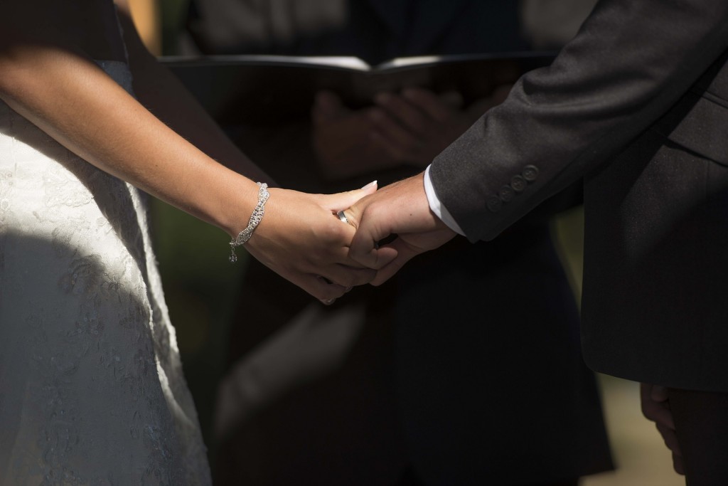 Married couple holding hands