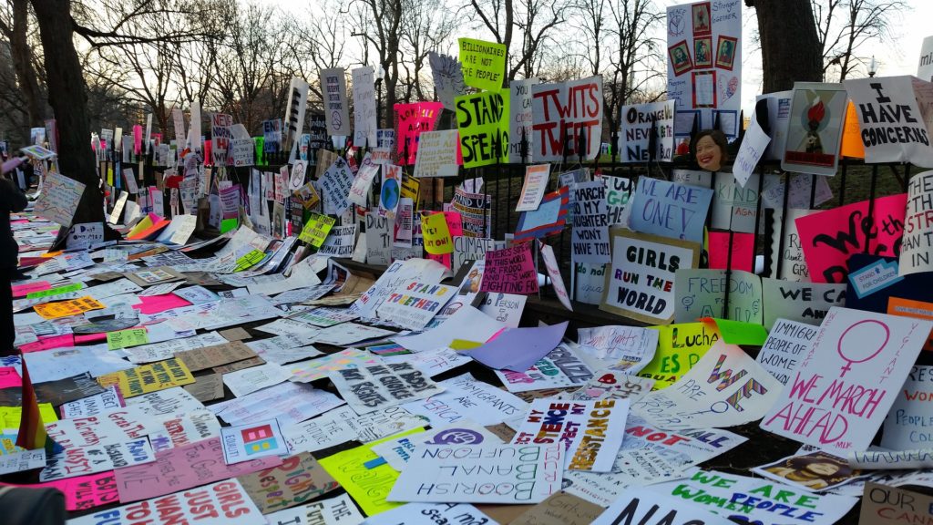 A collection of signs and placards from a women's march